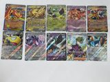 several pokemon cards are lined up on a white surface