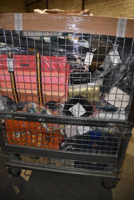a large metal cart with many items in it
