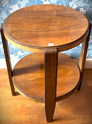 a wooden table with a glass top on a hard wood floor