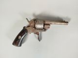 a toy gun that is sitting on a table