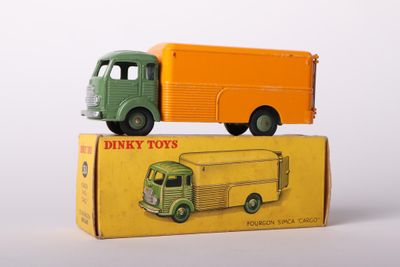 two toy trucks that are sitting on top of a box