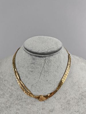a gold necklace on a mannequin mannequin mannequin mannequin mannequin mannequin mannequin mannequin mannequin