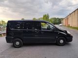 a black van that is parked on the side of the road