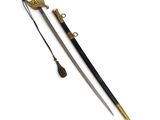 an old sword with a black handle and gold accents