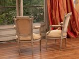 two chairs that are sitting in front of a window