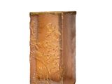 an image of a gold vase on a white surface