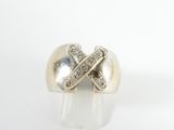 a close up of a white gold ring with diamonds on it