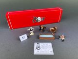 a red box with a set of miniature figurines on it