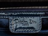 the inside of a black purse with a silver metal buckle