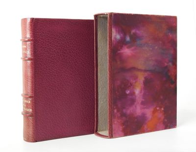 an open book with a pink cover and a red cover