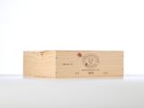 a close up of a wooden box on a table with a white background