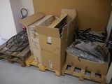 a pile of boxes sitting on pallets in a room