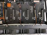 a close up of a computer board with wires attached to it