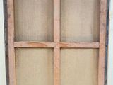 an old window frame with burlock cloth and a window pane