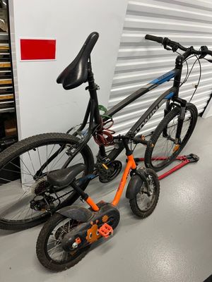 two bikes that are sitting next to each other on the floor