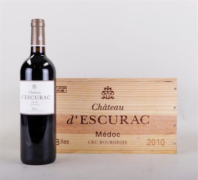 a bottle of red wine next to a wooden box