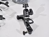 a small camera on a tripod next to some other items