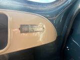 a close up of a car ' s dashboard with a sign on it