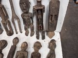 a lot of wooden figurines that are sitting on a table