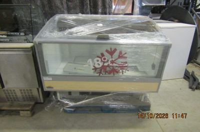 a fish tank sitting on top of a pallet in the middle of a room