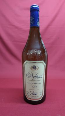 an image of a bottle of alcohol sitting on a table