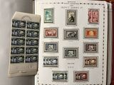 a book with stamps on it and a book with a picture of a man on it