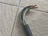 a close up of a piece of electrical wire on the floor