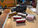 a lot of toy trains and trucks on a table