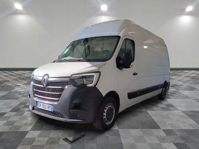 a white van that is parked on a checkered floor
