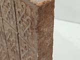 a close up of a piece of stone with writing on it