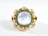 an image of a close up of a ring with a rainbow stone