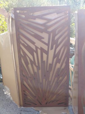 a couple of wooden gates sitting next to each other on top of a sidewalk