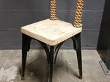 a chair with a rope on the back of it