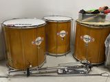 three drums that are sitting next to each other on the floor