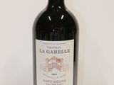 a bottle of wine that is sitting on a table