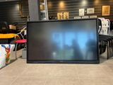 a large flat screen tv sitting on the floor