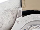 a close up of a watch with a leather band