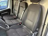 three seats in the back of a van that are empty