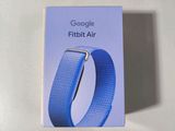 a box of google fitbit air wristbands sitting on a table