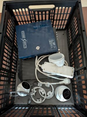 a basket that has a lot of electronics inside of it