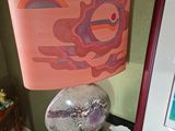 a table with a bowl of food and a lamp on it