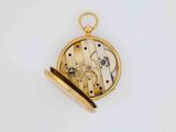 an image of a gold pocket watch with a white background