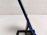 a tablet that is sitting on a stand on the table