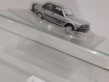 a toy car sitting on top of a clear display case