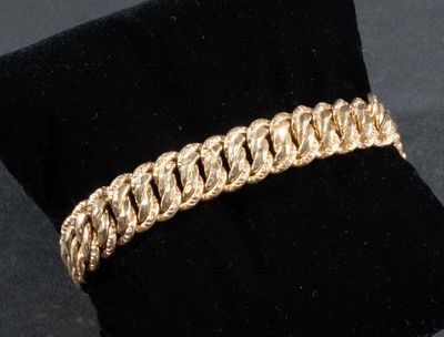 Bracelet gourmette maille américaine en or rose 750/°°°. Poi…