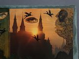 a picture of a picture of a castle with birds flying around it