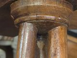 a close up of a wooden table with a wooden top