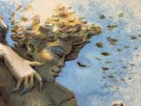 un tableau représentant un ange tenant un oiseau dans les airs