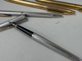 a lot of pens that are sitting on a table