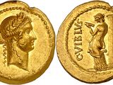 a gold coin with an image of a woman holding a sword